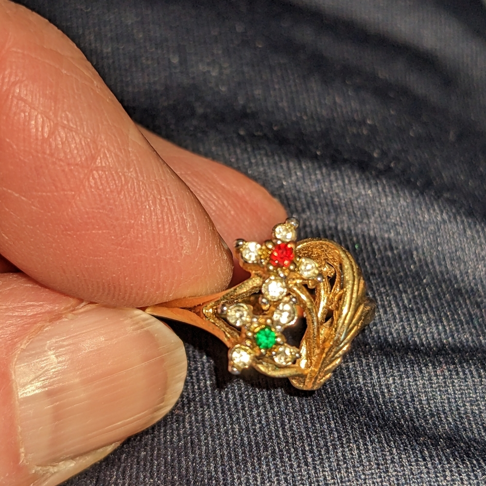 Gold ring with red and green floral design and clear side stones